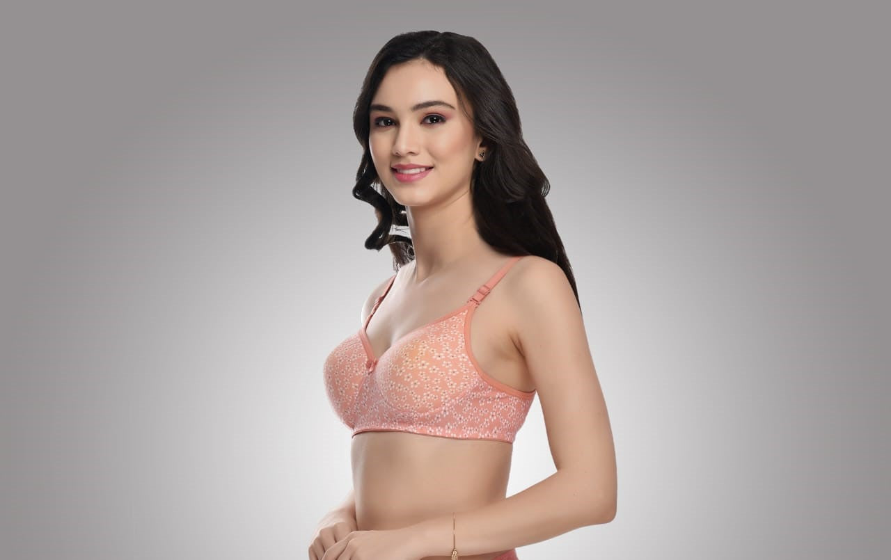 Liamoure Full Coverage Printed Padded Bra in light red with white floral print, offering stylish and comfortable support for everyday wear.