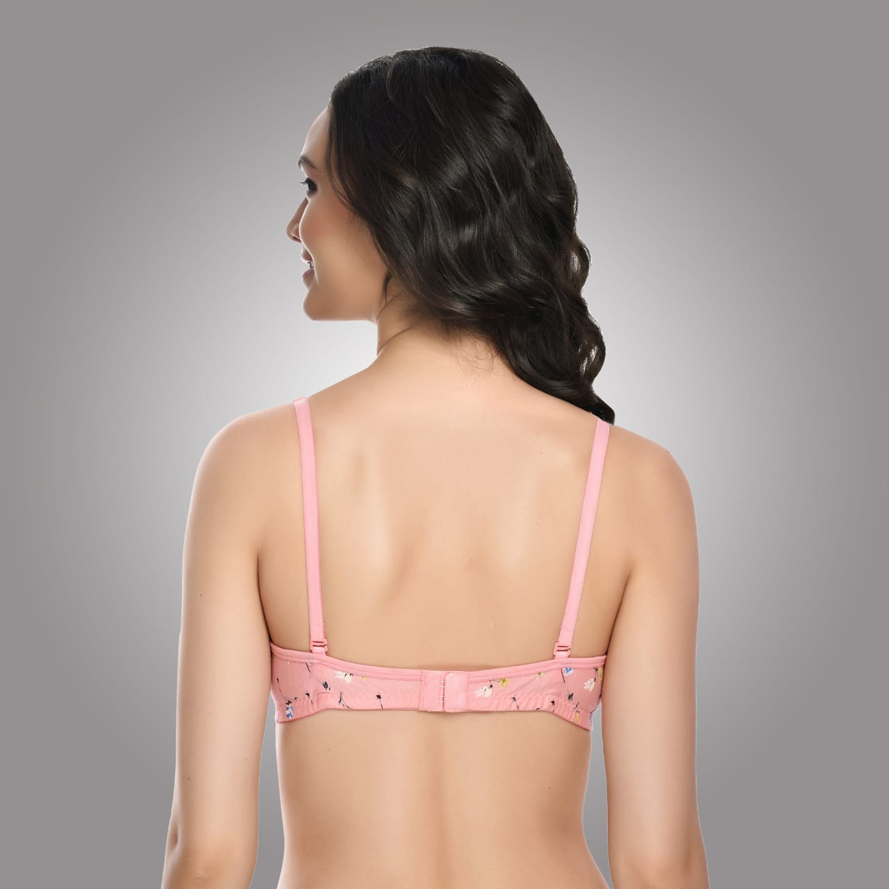 Back view of Liamoure pink floral printed bra featuring hook-and-eye closure and adjustable straps for secure support.