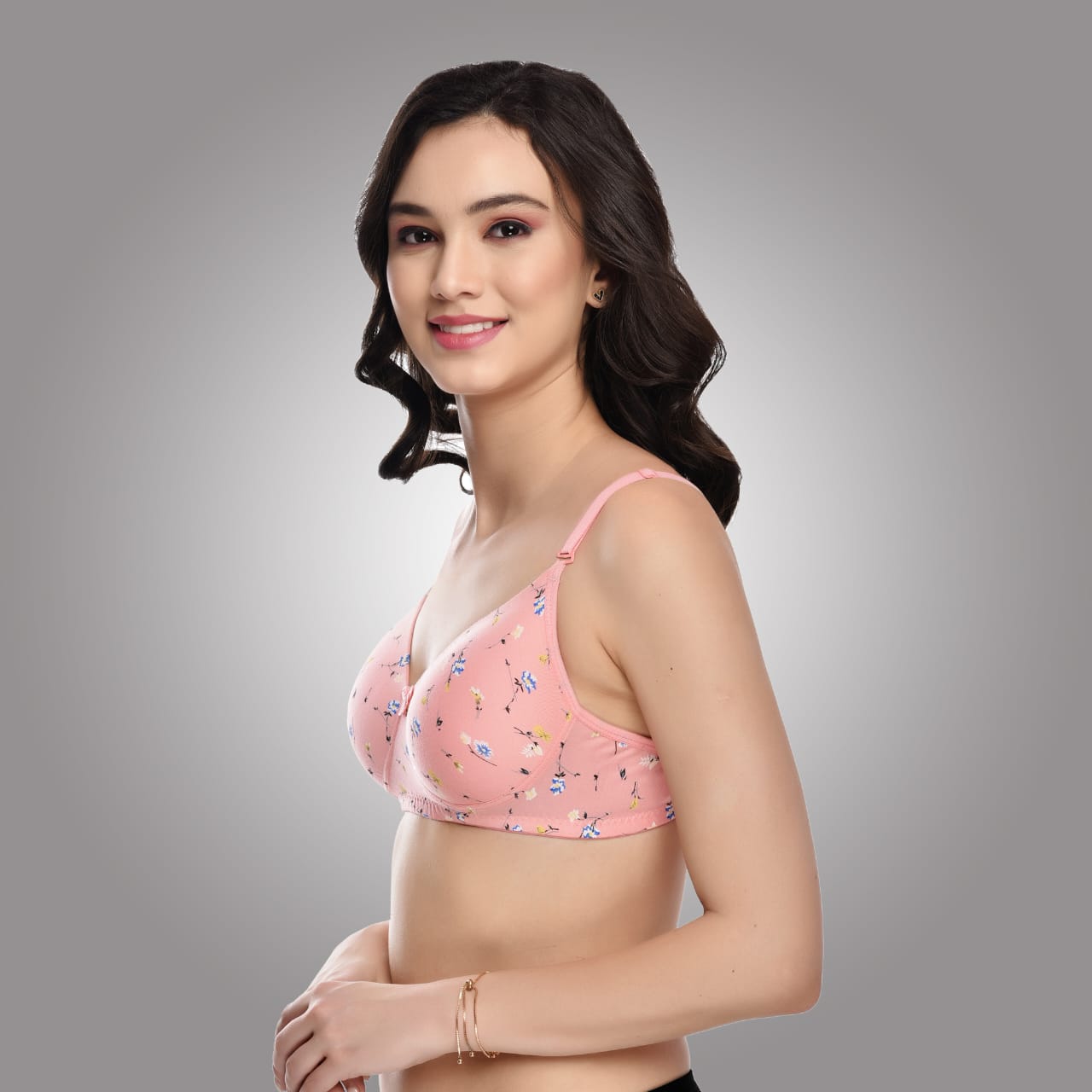 Angled side view of Liamoure pink floral printed bra with cotton fabric and adjustable straps for a snug fit.